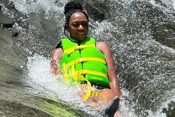 a person riding a wave on top of a body of water