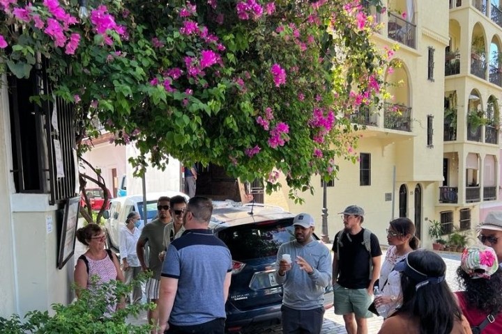 a group of people standing in front of a building