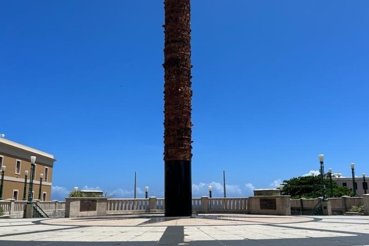 a tower with a clock on the side of a building