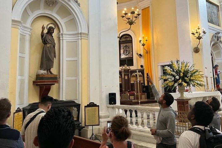 a group of people sitting in front of a building