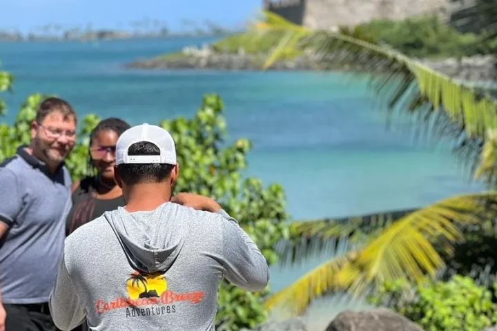 a man holding a fish in the water
